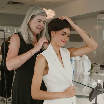 Patti helping one of Glitters models with a necklace